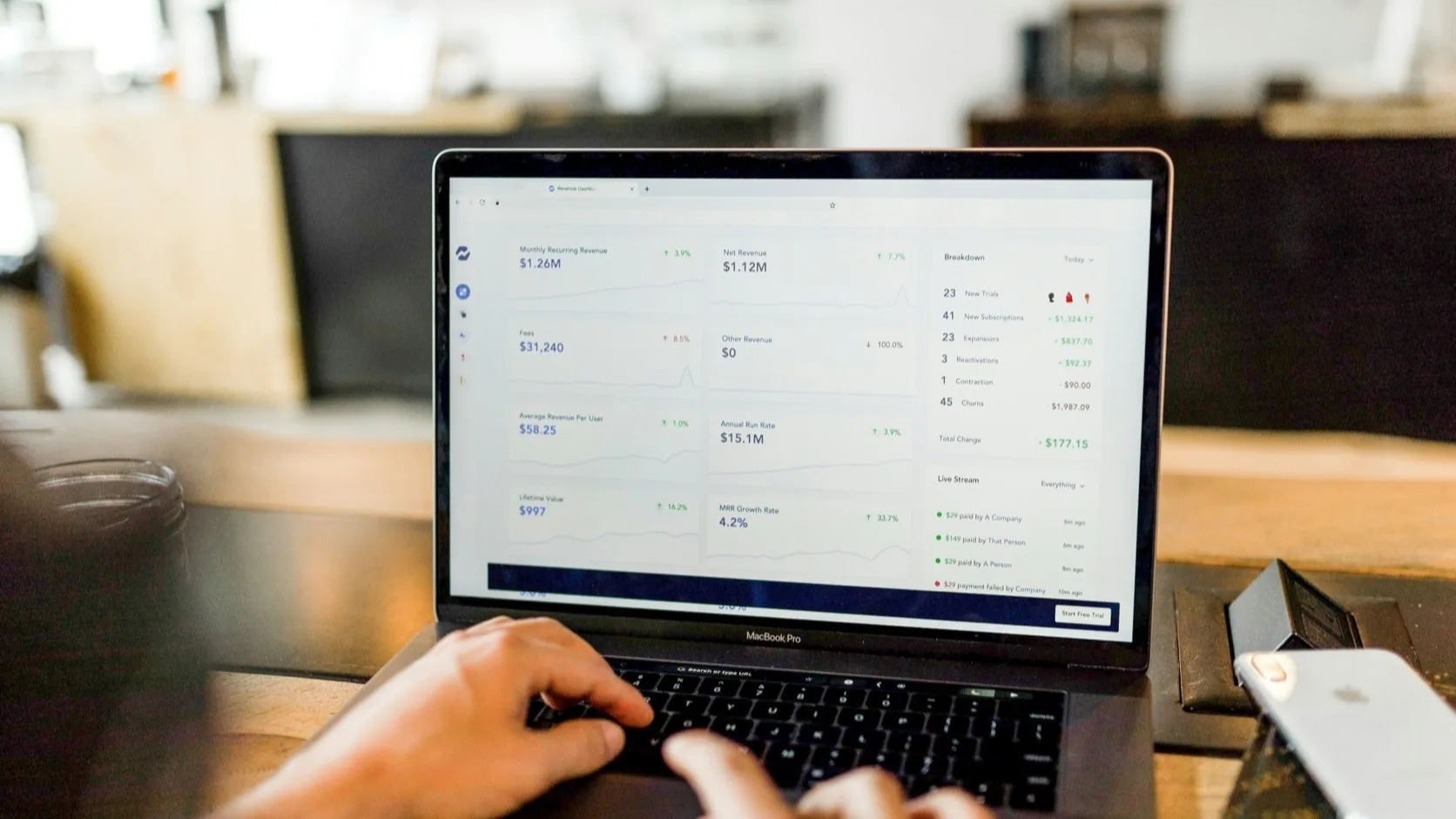 Founder comparing freemium and paid app monetization models before building
