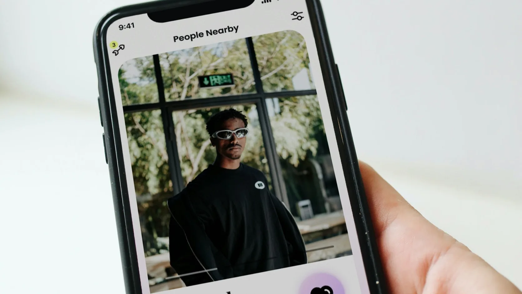 A person writing Hinge prompt answers on a dating app profile
