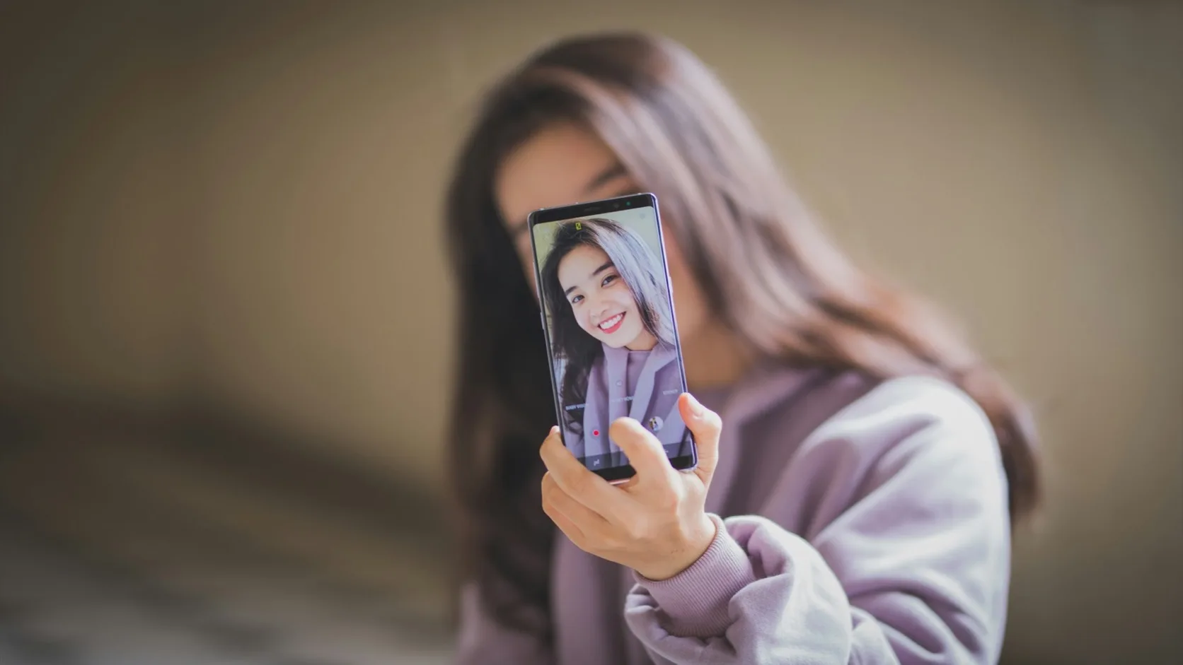 A person reviewing dating app profile pictures before matching