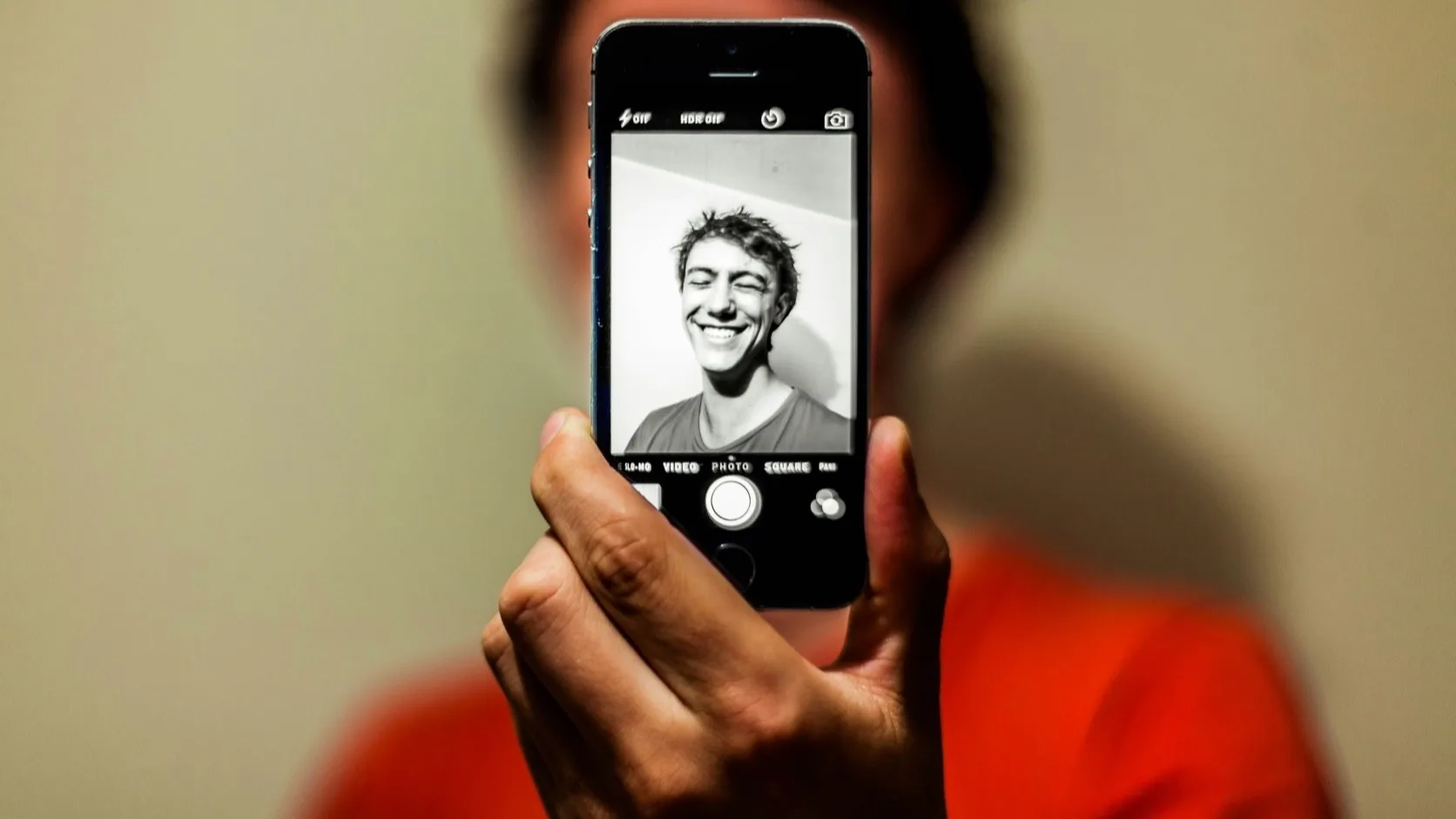 A guy improving his Tinder bio to get more dating app matches